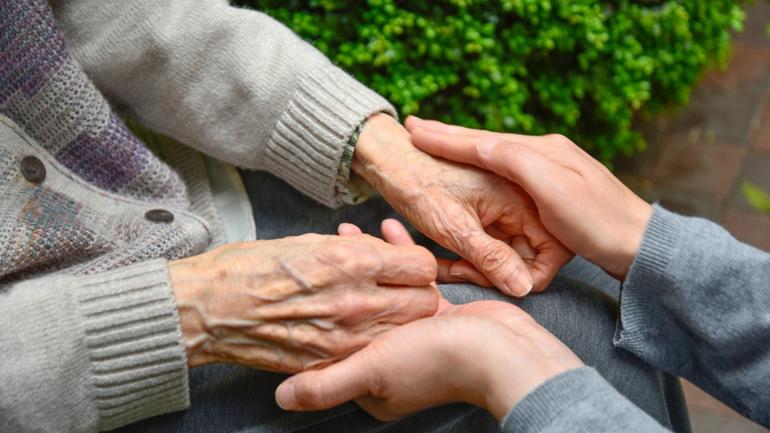Contra Costa Senior Services Team Member sitting with elderly person | All Seasons Homecare